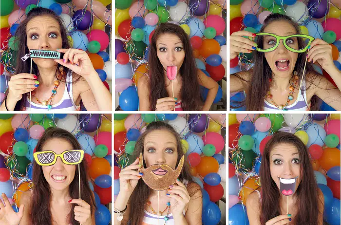 girl using props in a photo booth