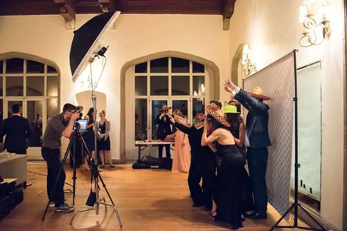 photographer capturing guests at a party on camera