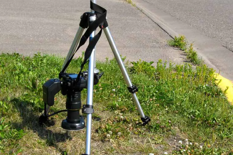 a camera set up for taking a picture on the ground